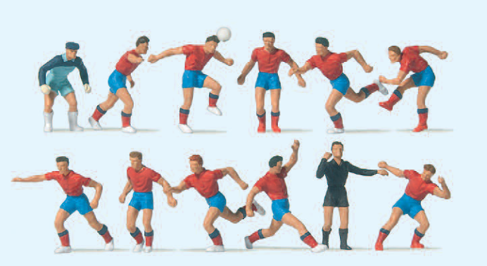 Fußballmannschaft. Rote Trikots, blaue Hosen