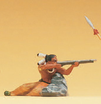 Indianer am Fels liegend, mit Gewehr