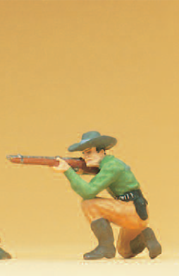 Cowboy kniend, mit Gewehr