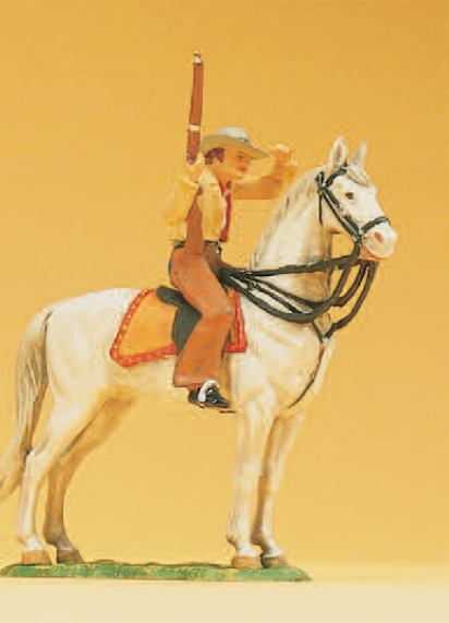Cowboy zu Pferd, mit Gewehr